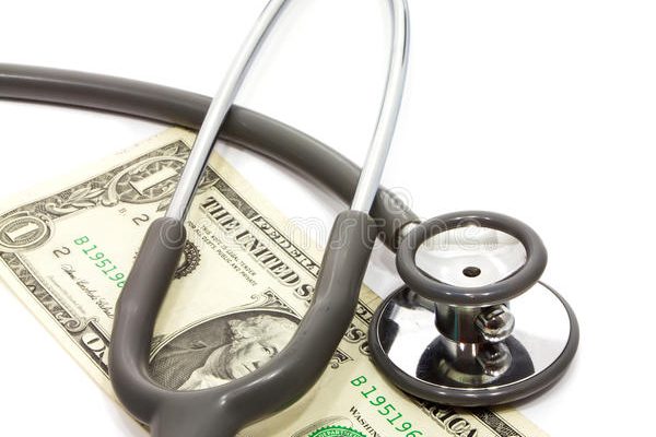 stethoscope-cash-over-one-dollar-white-background-34420718